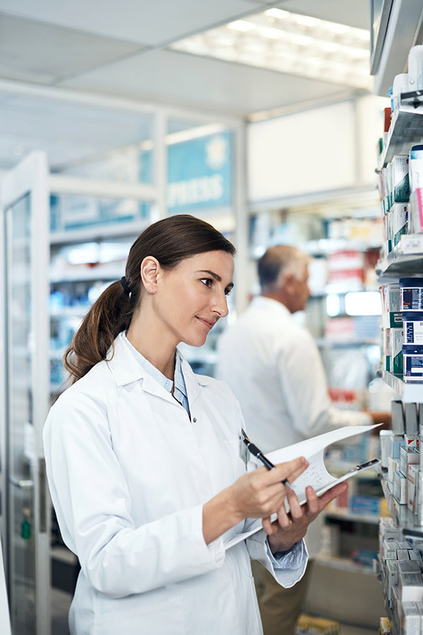 Pharmacist checking inventory
